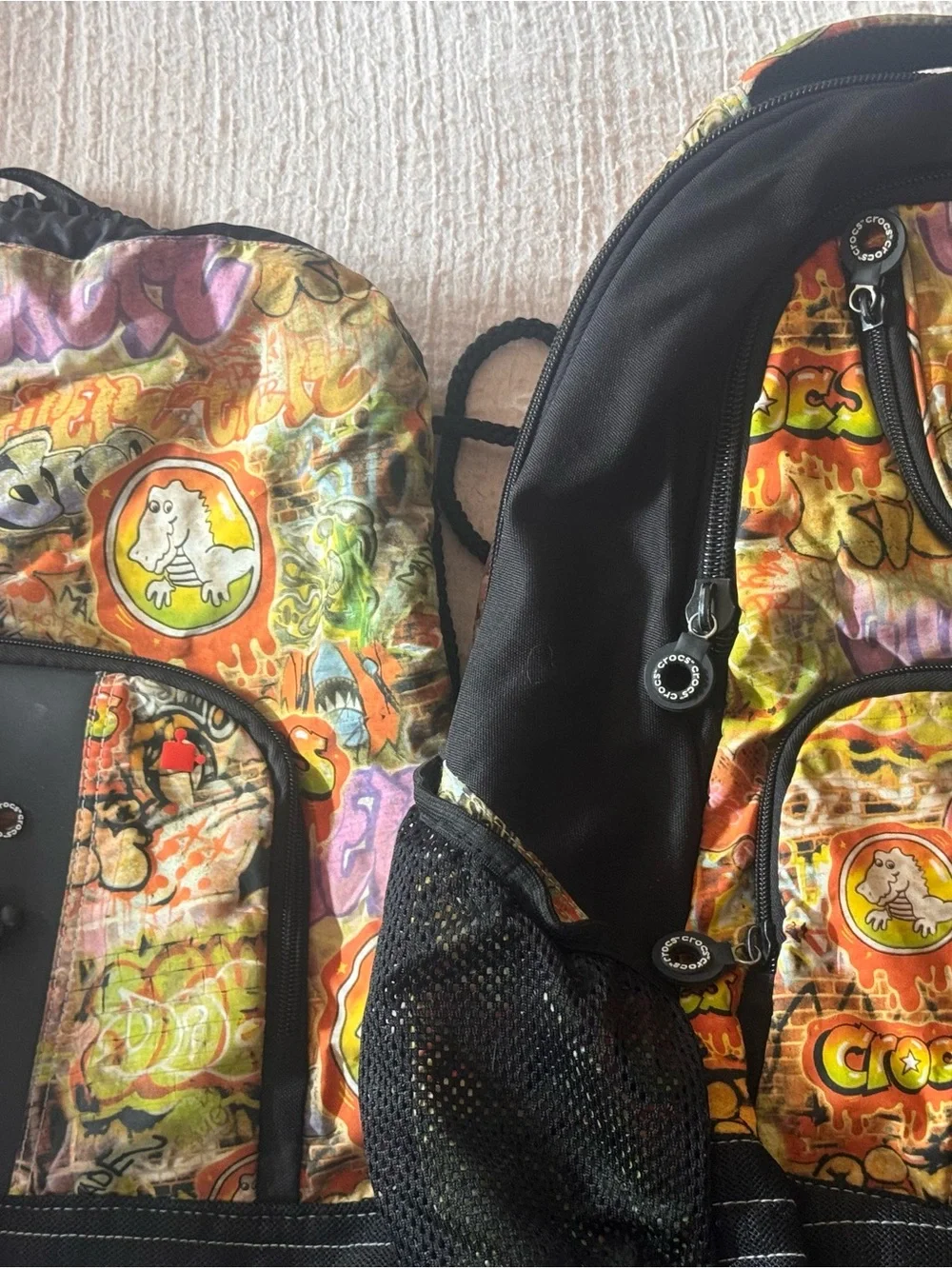 (2) CROCS Graffiti Backpack in Orange, Green, Yellow, Purple